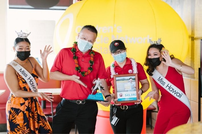 Miss Hawaii winners celebrating with Panda Express employees.