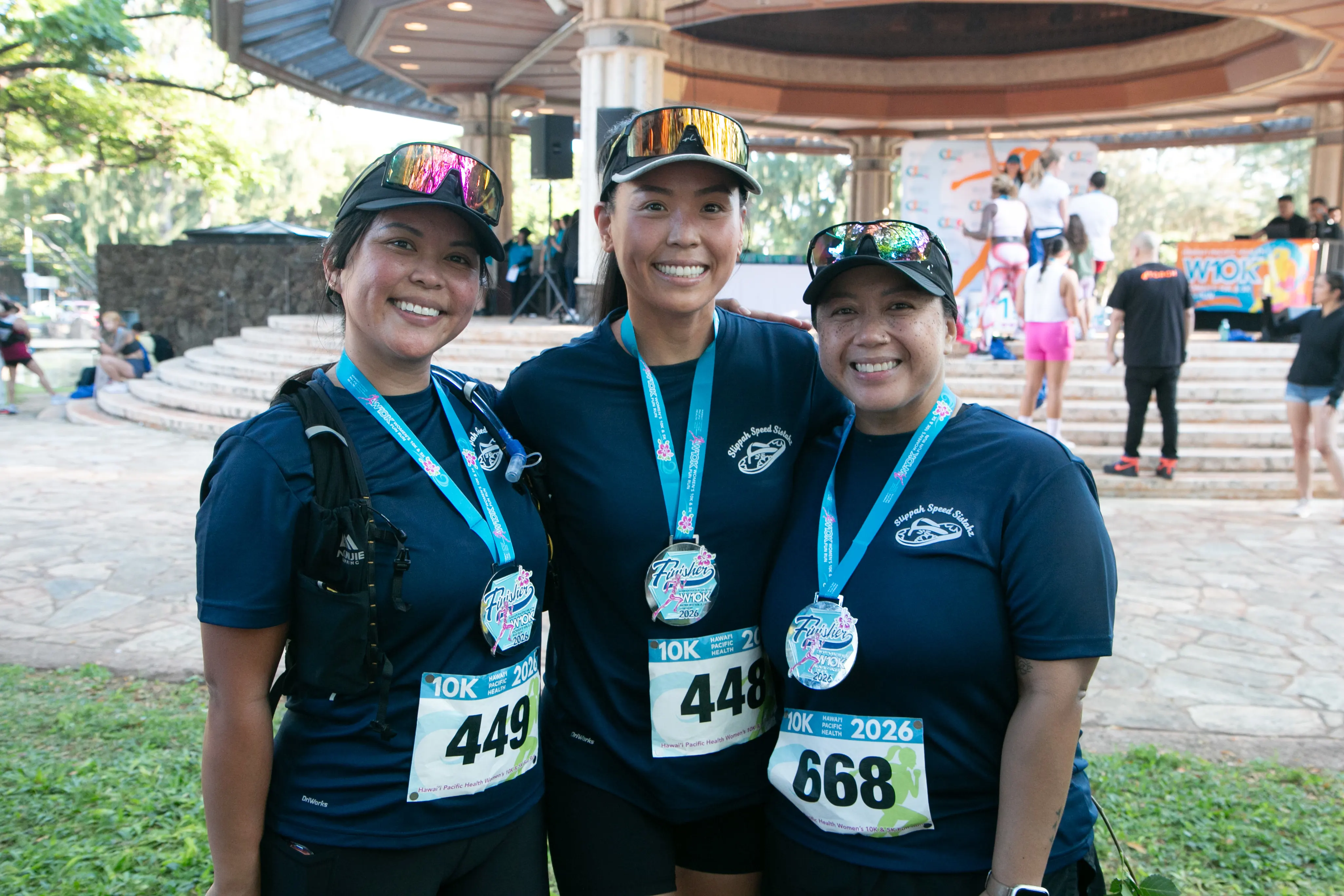 10K race finishers in matching navy blue outfits.