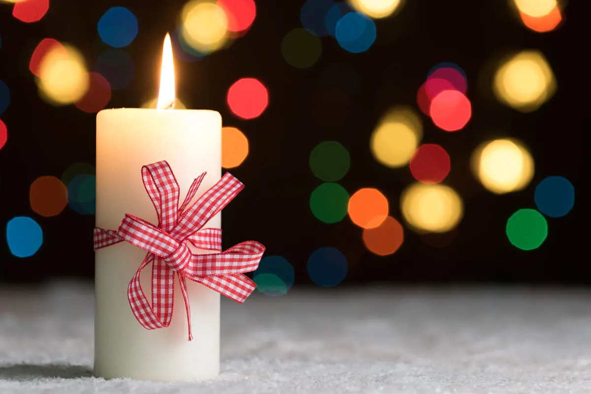 A burning holiday candle.
