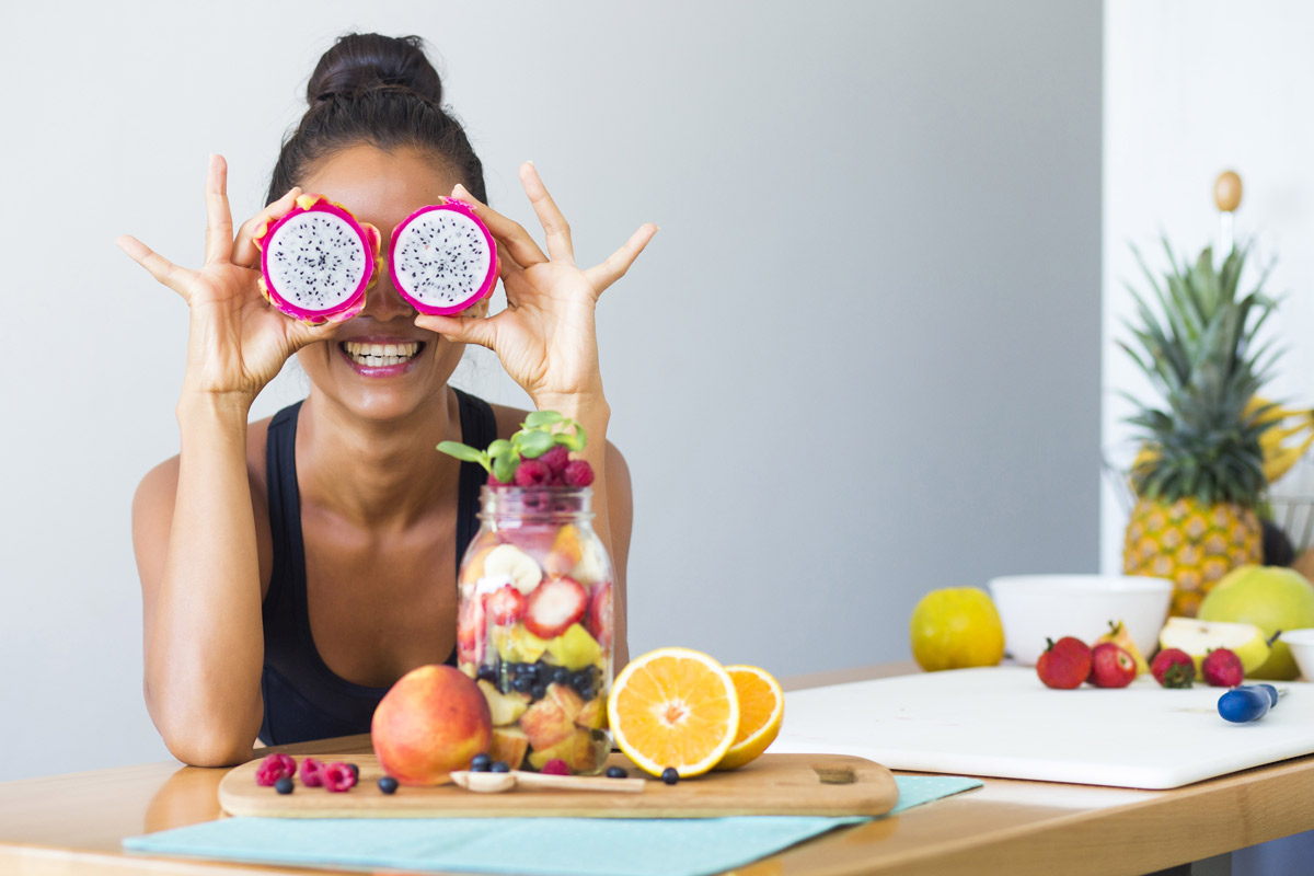 A woman playing with her healthy food.