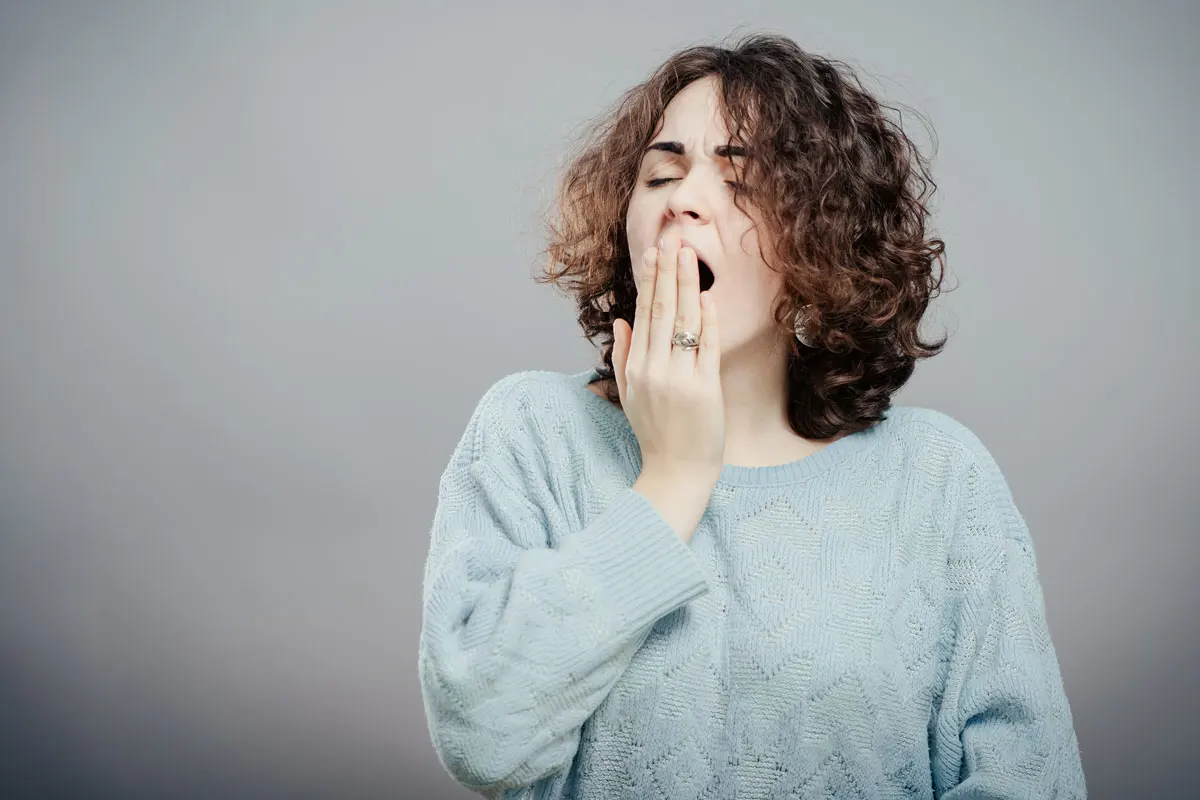 Woman yawning. 