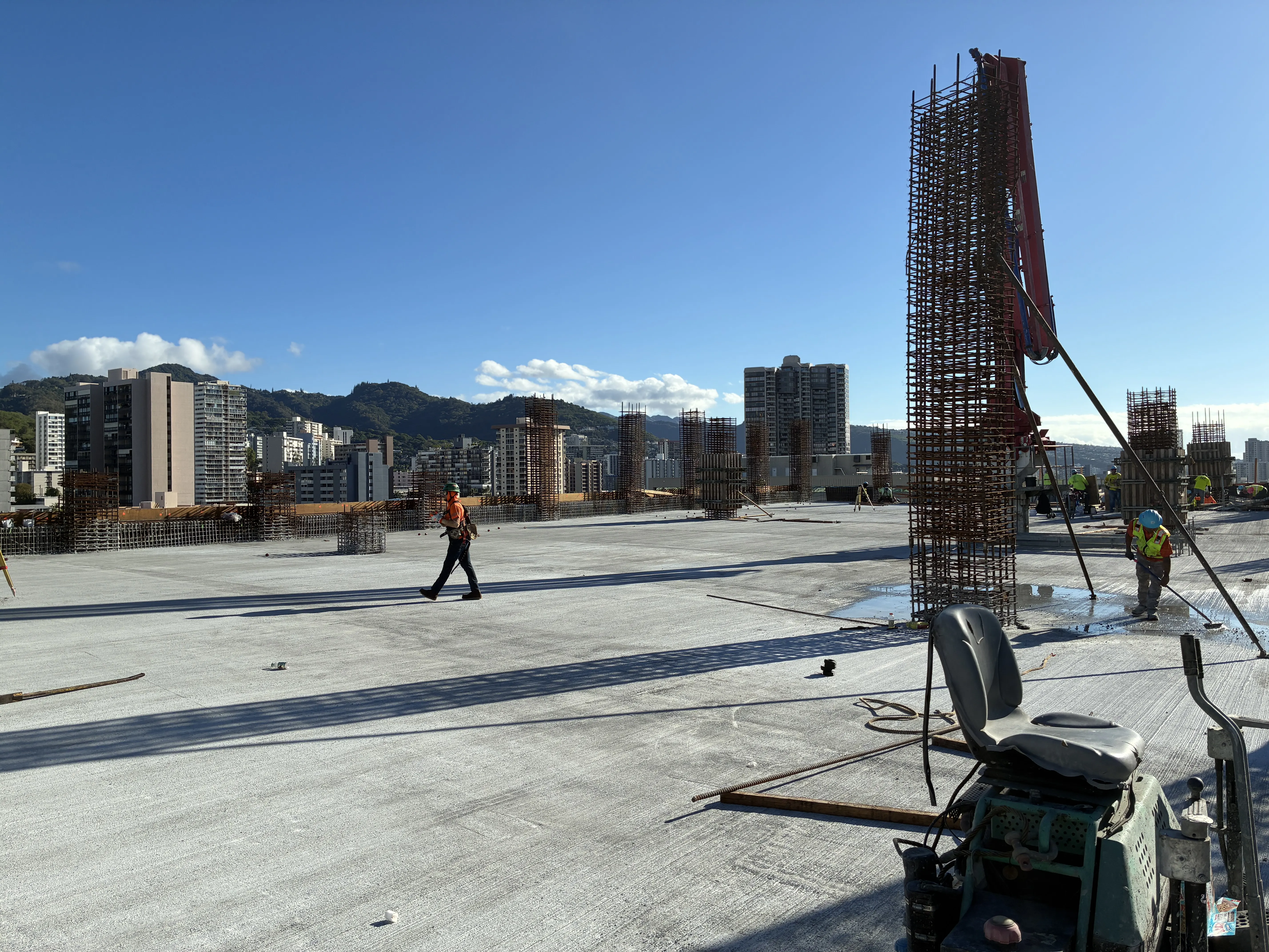 The parking structure rises.