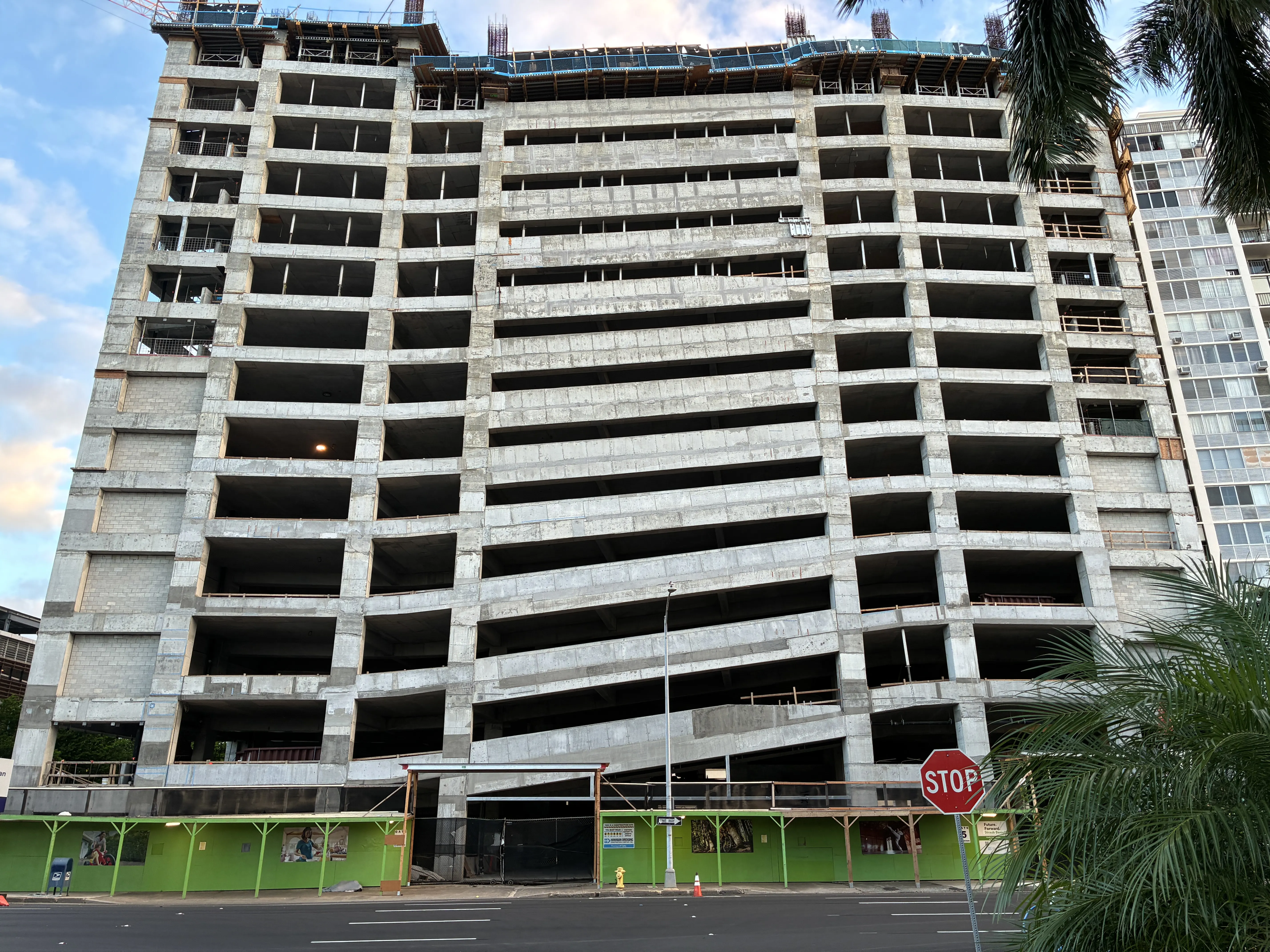 The parking structure rises.