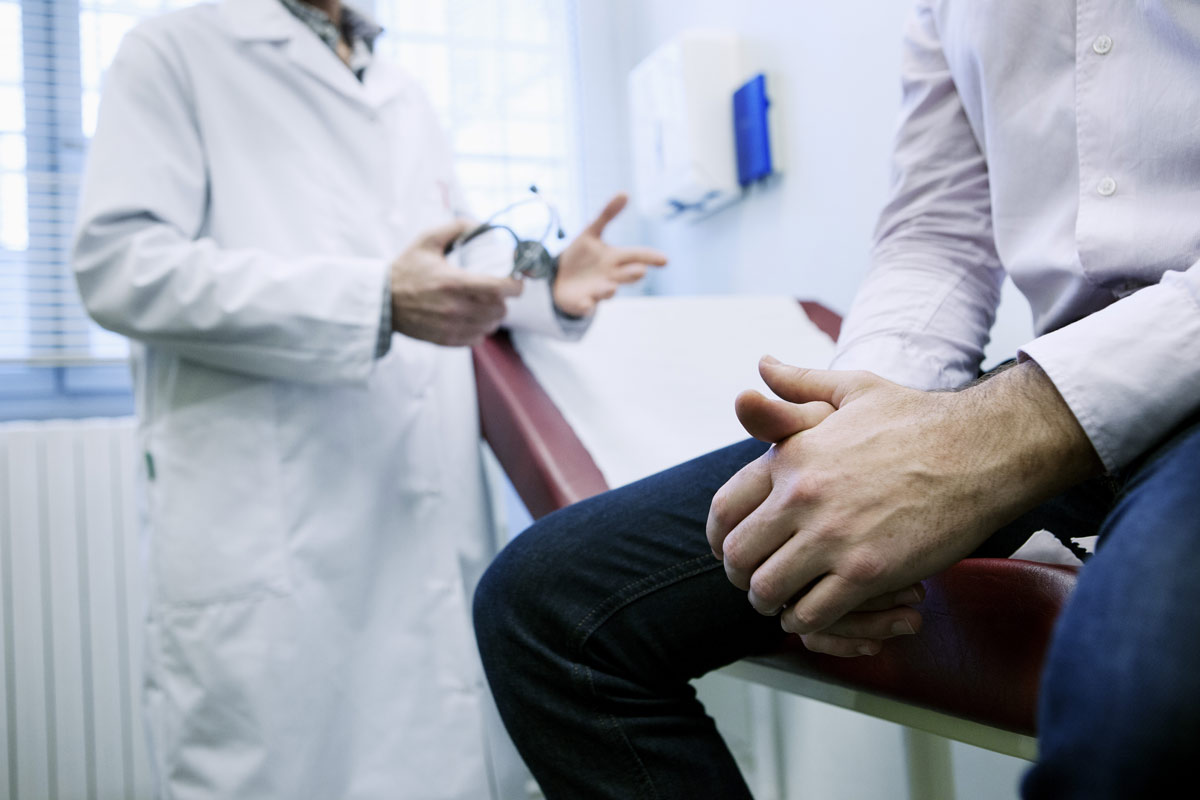 A doctor diagnosing a patient.