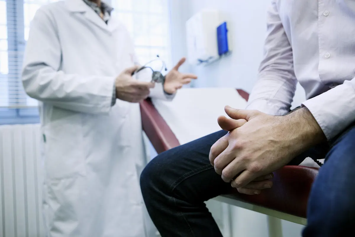A doctor diagnosing a patient.