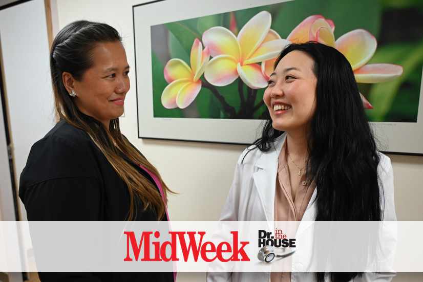 Dr. Marissa Sakoda and a patient standing in the hall discussing peripheral nerve relief.