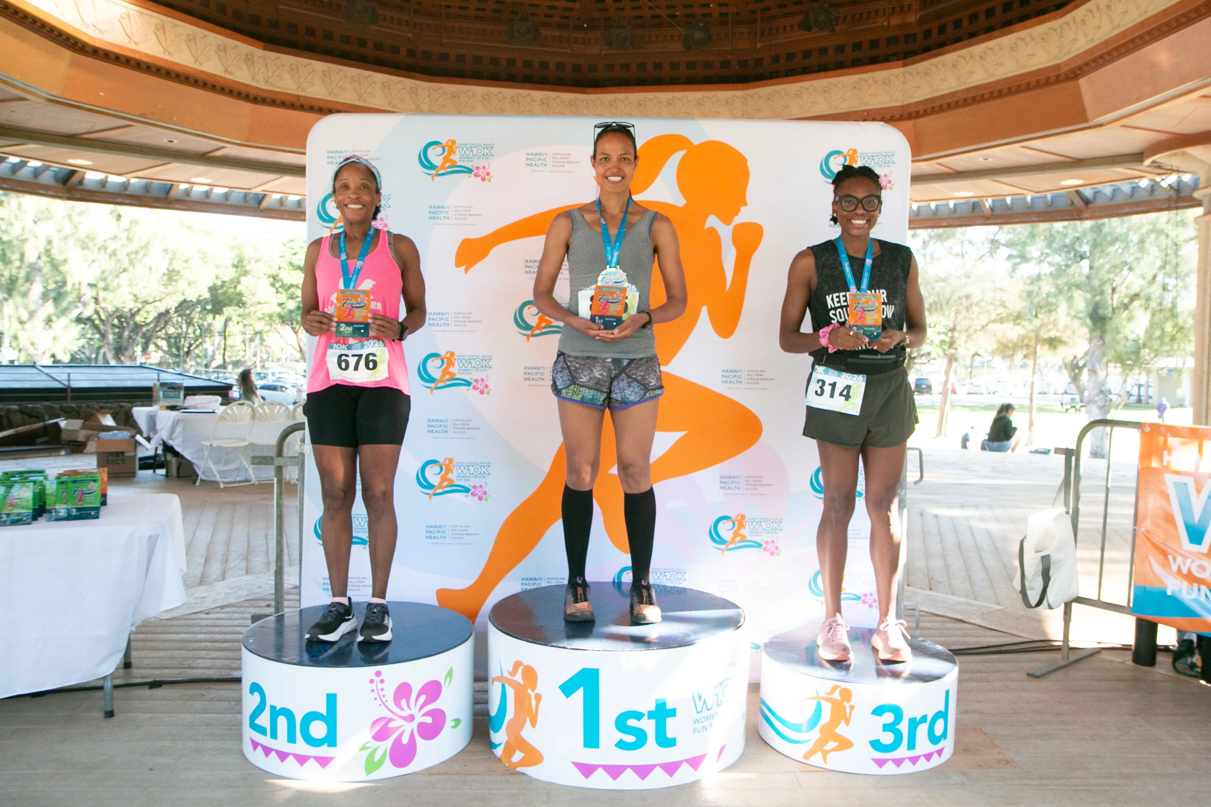 10K age division winners standing on the winner podiums.