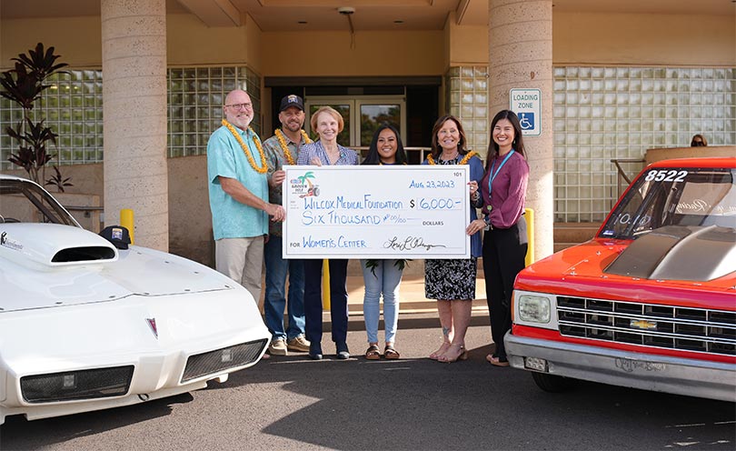 Group of six people standing in the Wilcox roundabout holding a giant check for $6,000. 