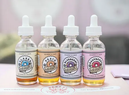 Four bottles of flavored vaping liquids.