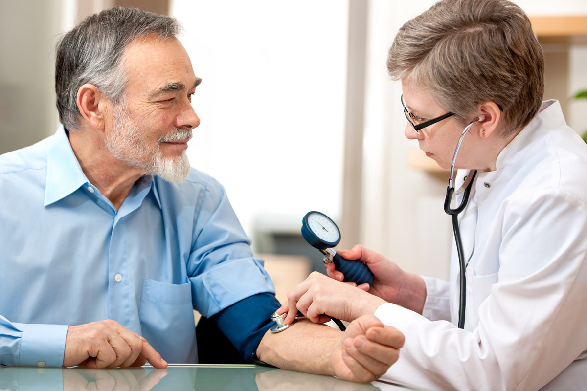 Man getting regular examination from doctor.