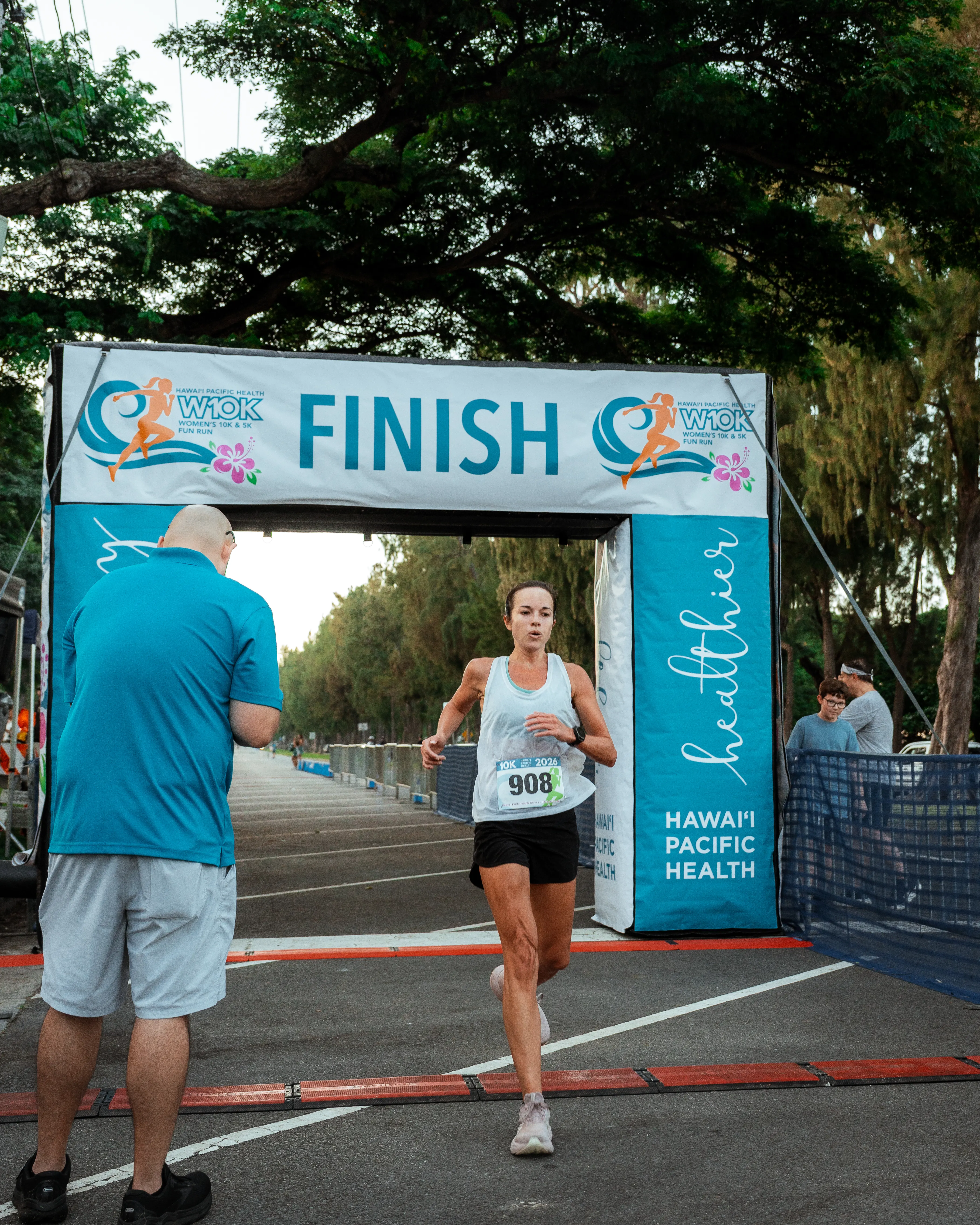 First 10K finisher crossing the finish line.