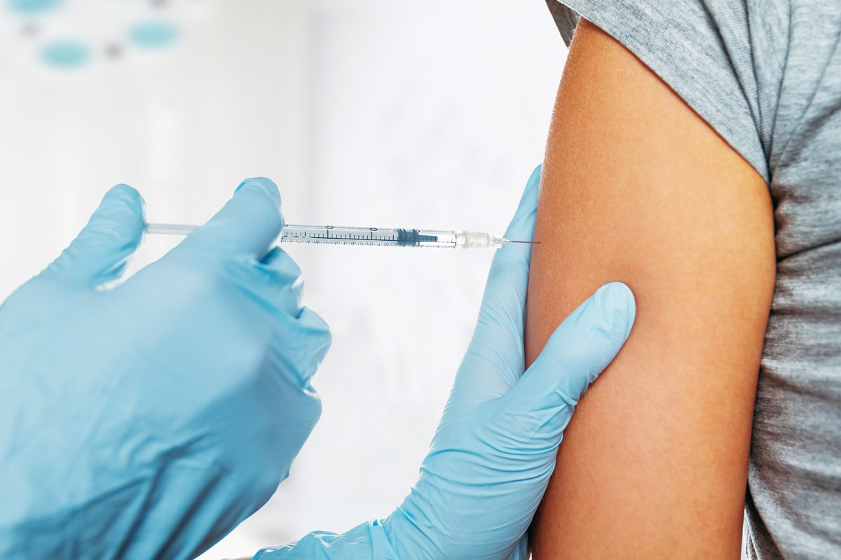 A child patient getting an immunization shot.
