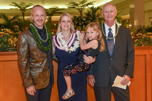 Honoree smiling and celebrating with her family.