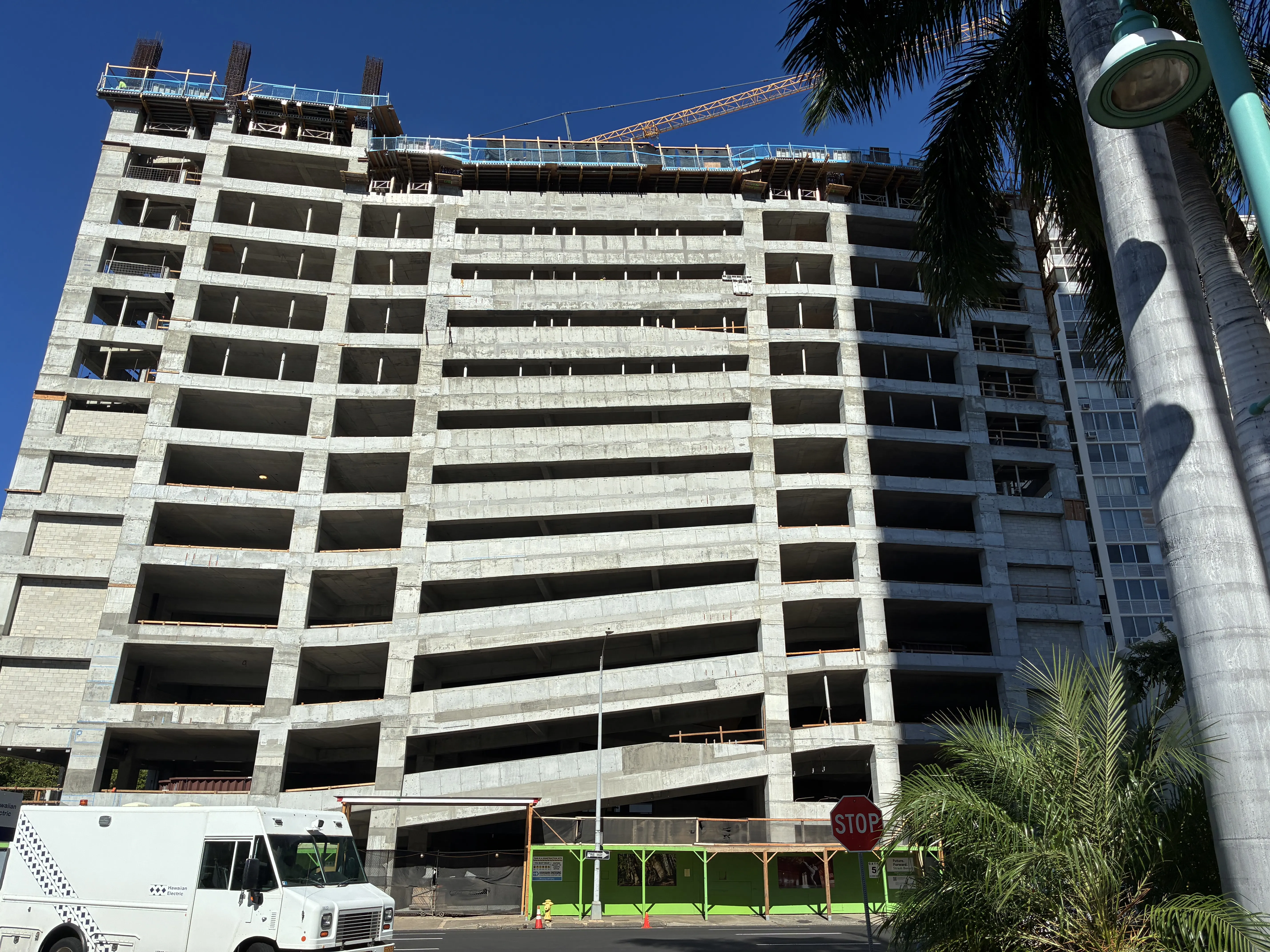 The parking structure rises.