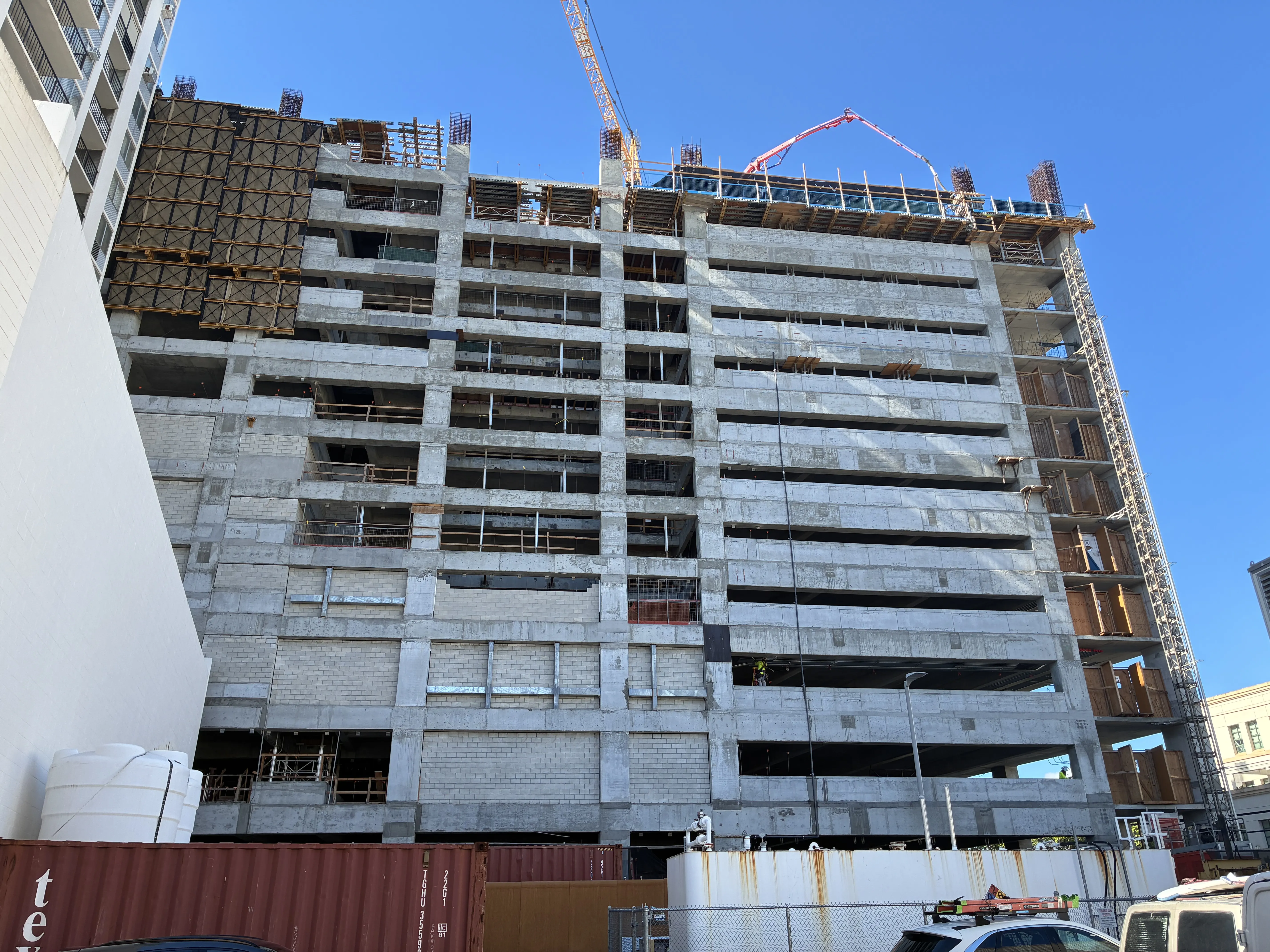 The parking structure rises.