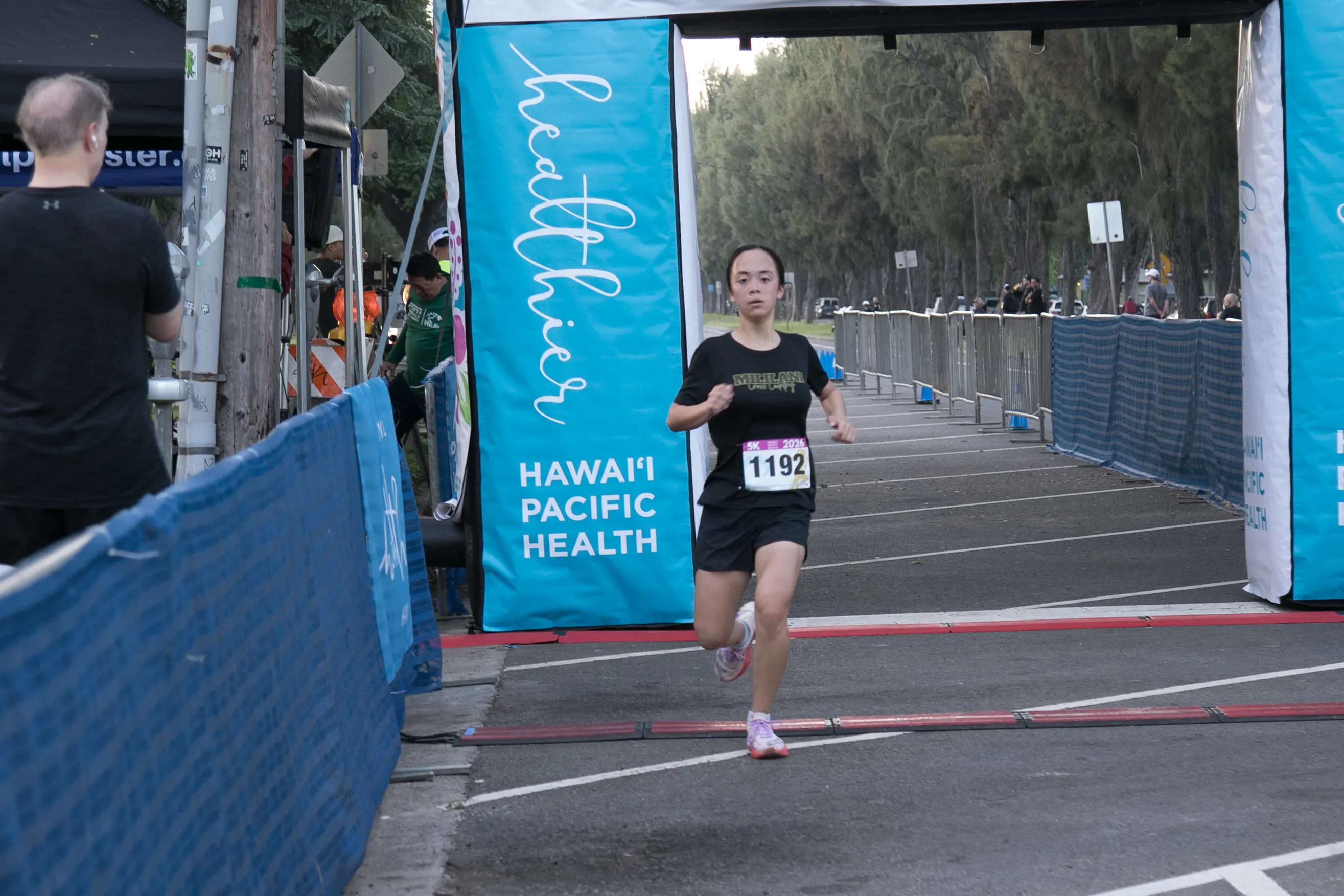 One of the top 5K finishers coming through the finish line.