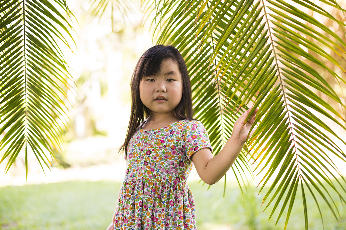 Young girl playing in the forest.