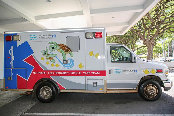Kapiolani Medical Center Ambulance with illustrations of animated turtles and fish on the side. 