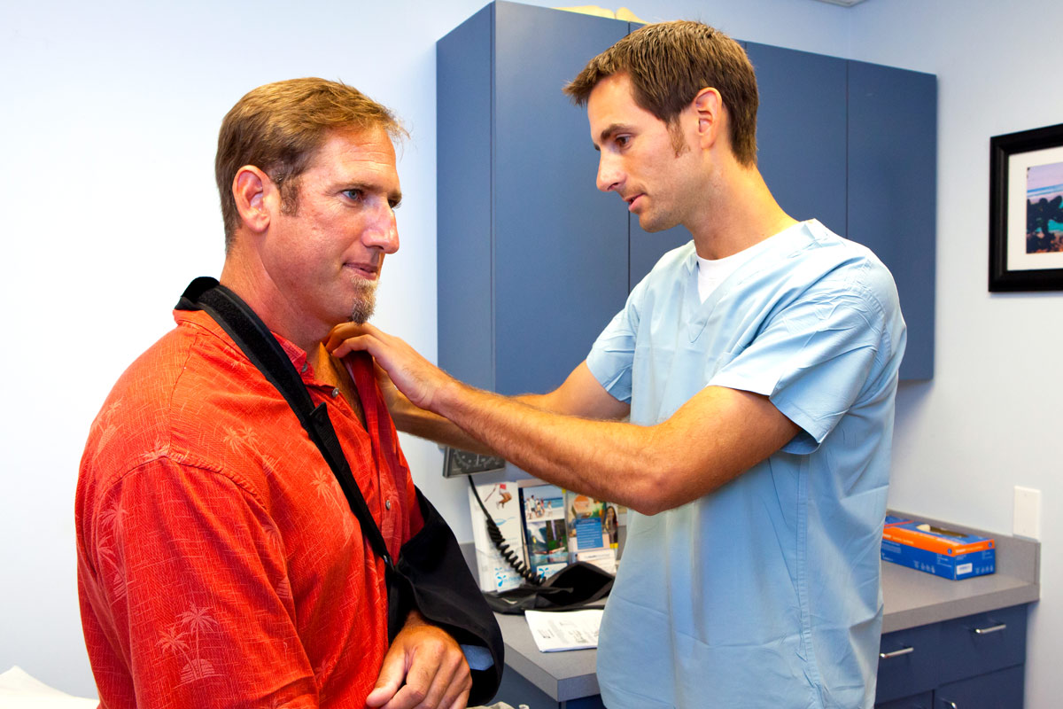 A man getting treatment for his dislocated shoulder.