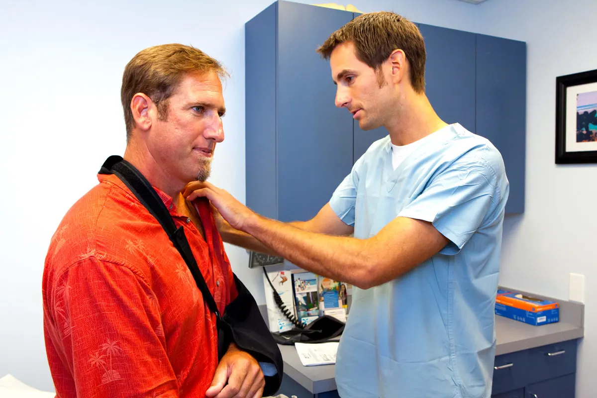 A man getting treatment for his dislocated shoulder.