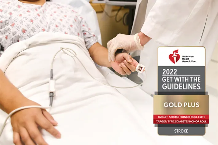 stock image of a physician checking a patient's vitals.