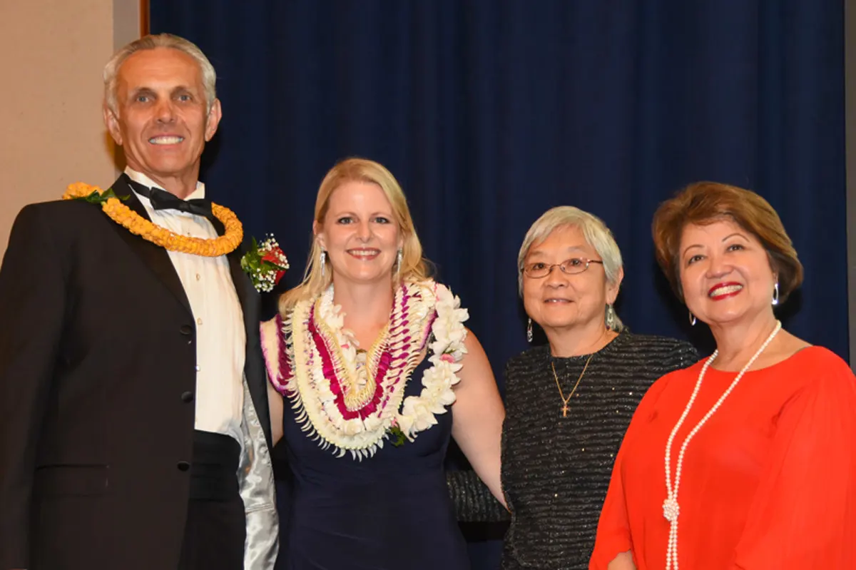 Honoree smiling with three other healthcare professionals.