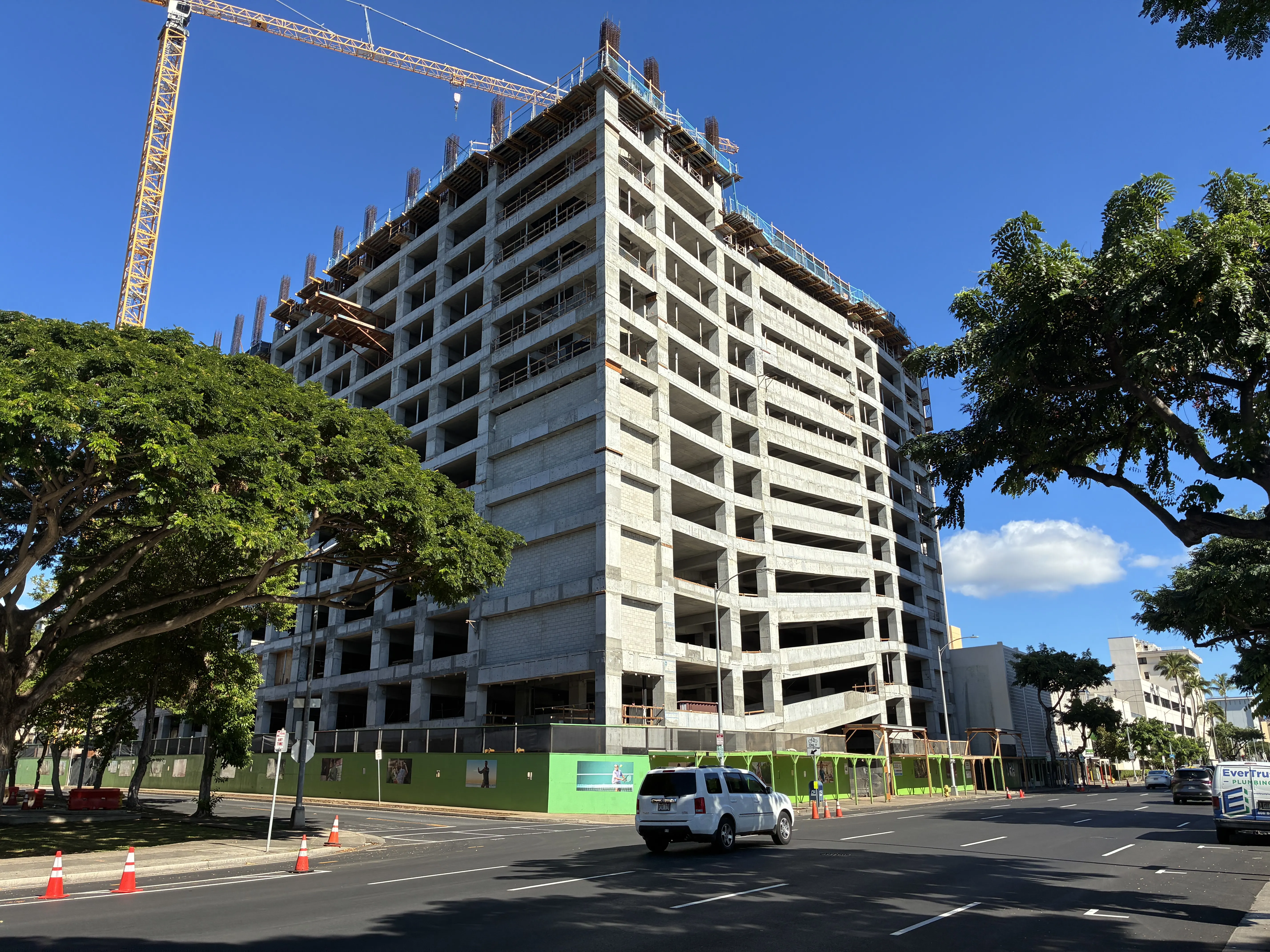 The parking structure rises.