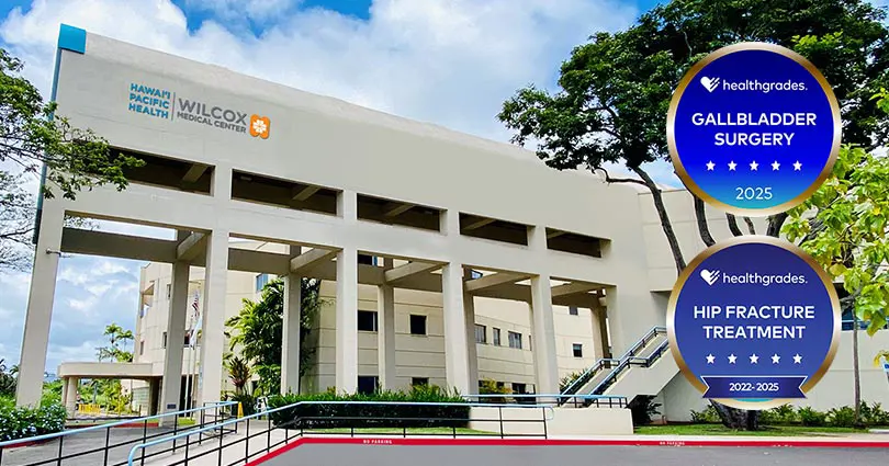Healthgrades medallions for various distinctions in specialty care alongside Wilcox Medical Center exterior.