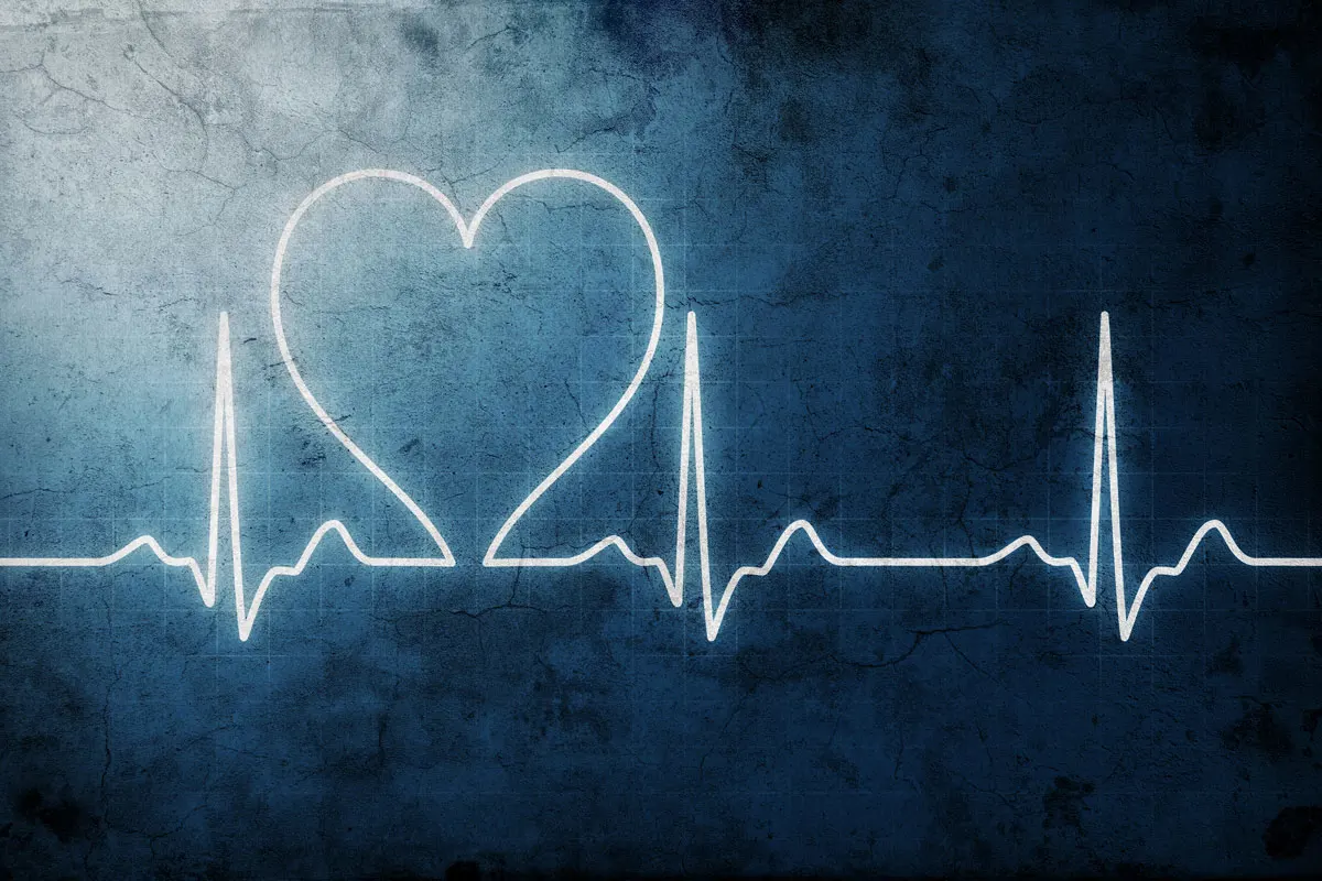 An ekg monitor with a representative heart image.