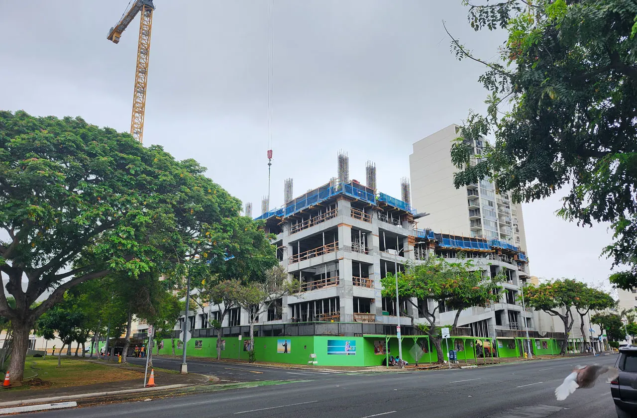 The parking structure rises.